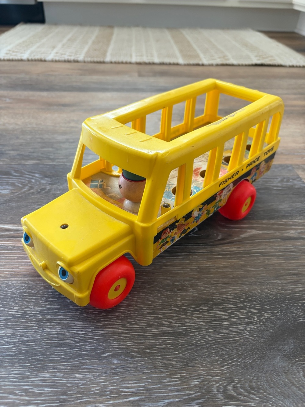 Fisher-Price Yellow School Bus Toy with Red Wheels